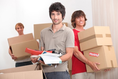 Small removals van loading furniture in South Ruislip