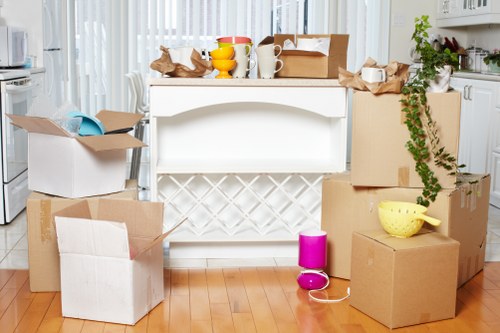 Organized self storage unit in Southruislip with boxes and furniture